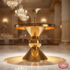 Gold hourglass trumpet base cake table side view grand ballroom uplighting hourglass shadow marble