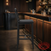 Black industrial bar stool at upscale hotel restaurant bar dark walnut interior