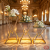 Silver geometric X-frame 3 stands side view grand ballroom cascading staircase warm uplighting