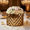 Gold fish-scale panel box at hotel banquet table scallop 3D detail warm spotlights 45 degree