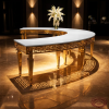 Gold crescent banquet table side view hotel uplighting fretwork pattern shadow marble floor