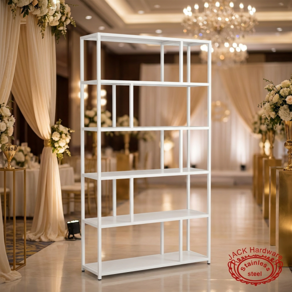 White display rack at elegant hotel event space warm gold ivory lighting