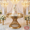 Gold spiral woven column Greek key rim cake stand with tiered wedding cake fretwork border chandeliers