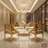 Gold perforated circular hole armchairs at modern luxury hotel lounge chandeliers marble
