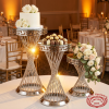Silver spiral lattice column stands at hotel wedding reception desserts gold spotlights 45 degree