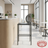 Arc ring bar stool at boutique hotel lobby cafe natural light