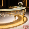 Gold crescent crystal pendant table side view hotel rainbow prismatic sparkle floor warm uplighting