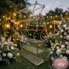 Silver glass tier rack at outdoor evening garden wedding fairy lights floral backdrop