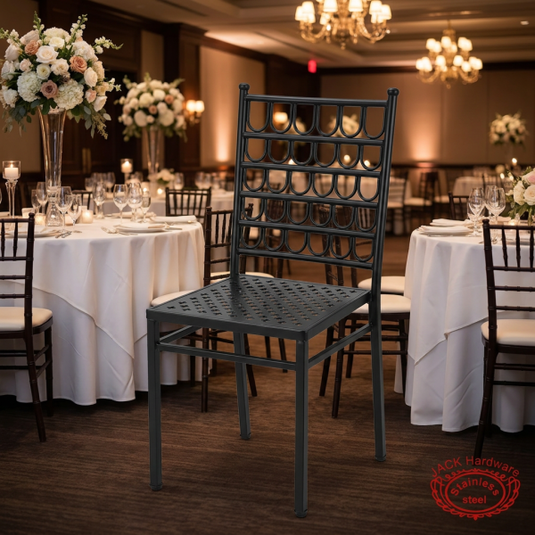 Black stackable chairs at upscale hotel banquet hall white tablecloths floral centerpieces