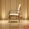 Silver stud oval armchair side view luxury event stud rim oval backrest warm light marble