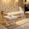 White twig bench set at wedding reception lounge 45 degree twig frame detail warm golden light
