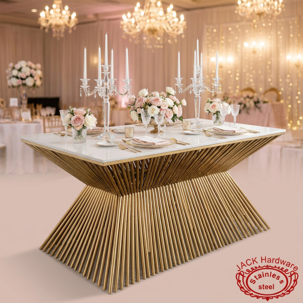 Gold sculptural fountain base dining table at upscale hotel wedding banquet candelabras blush roses