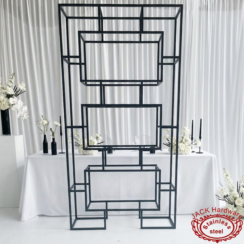 Black pyramid display stand at modern minimalist wedding venue black white decor