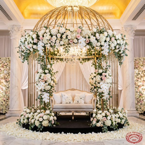 Gold birdcage dome pavilion at grand wedding reception hall full florals crystal chandeliers