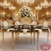 Gold ball-node leg black mirror round table at luxury hotel banquet hall candelabras white roses chandeliers