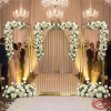 Gold 3-piece screen set as luxury wedding welcome entry floral garlands warm spotlights rose petal aisle