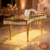 Gold crescent crystal pendant spindle legs table side view hotel crystal sparkle marble floor uplighting