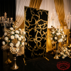 Black gold floral screen at luxury wedding reception dramatic gold black event styling roses candelabras