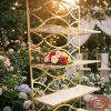 Gold white wave display stand at romantic garden wedding dusk golden hour bokeh