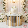 Silver gold dual-color cylinder stand at wedding dessert display cake frosted glass floral backdrop