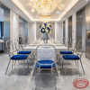 Silver cutout frame chairs at luxury hotel restaurant dinner table chandeliers royal blue cushion