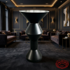 Matte black hourglass cocktail table at luxury boutique hotel lounge dark moody gold accents
