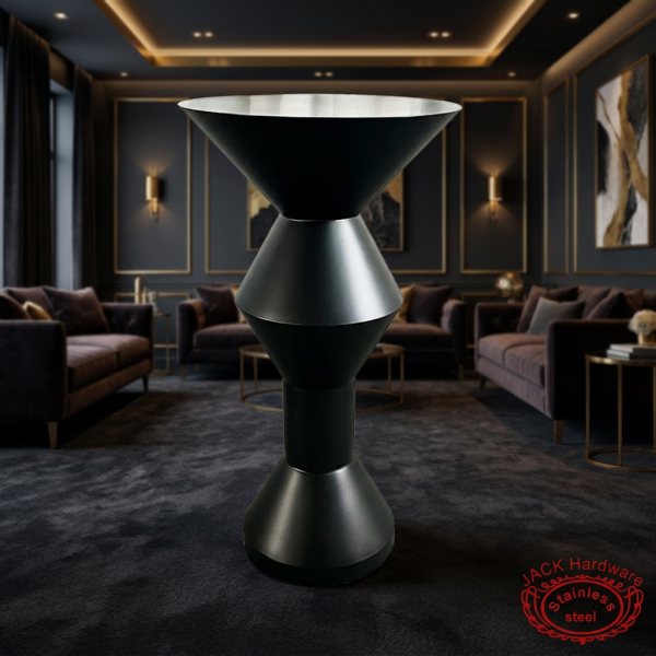 Matte black hourglass cocktail table at luxury boutique hotel lounge dark moody gold accents