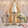 Silver 3-piece spiral lattice cake stands at wedding dessert station tiered cake macarons florals