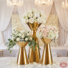 Gold double-trumpet hourglass 3-piece stands at wedding floral display white peonies roses chandeliers