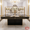 Black gold signing desk at wedding entrance guest book roses chandeliers foyer