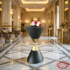 Dark grey gold sphere cocktail table in 5-star hotel lobby marble floors gold architectural details